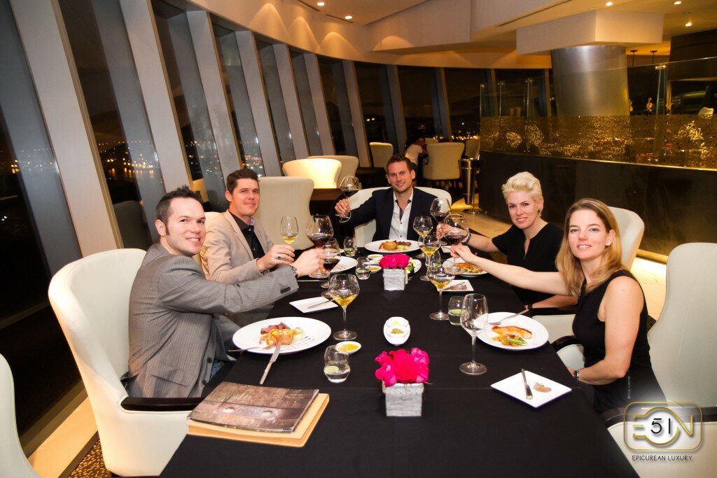 Eon51 Fine Dining Guest Toasting Luxury Dinner